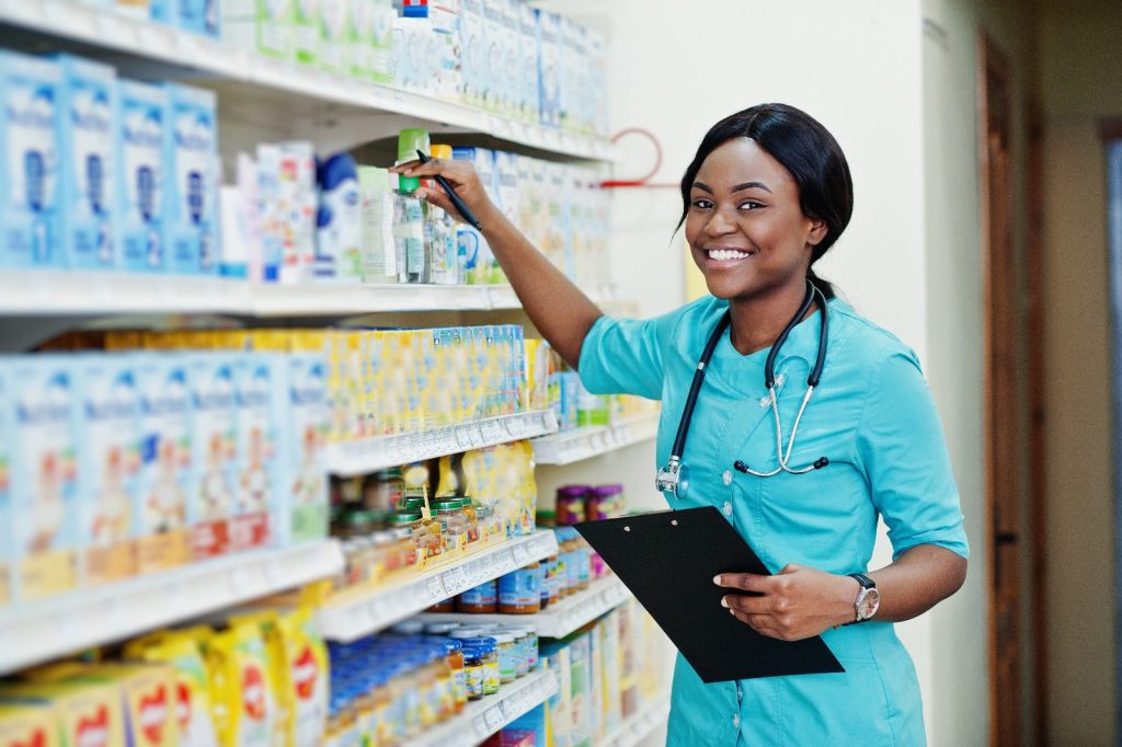 Pharmacist checking stock so refills line up on one date