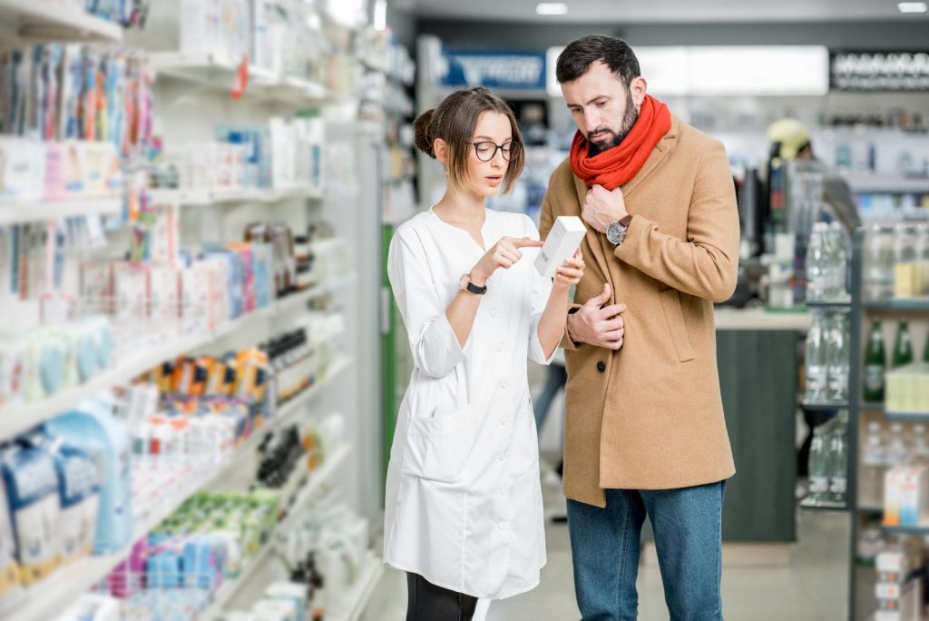 Pharmacist helping a customer at the pharmacy counter