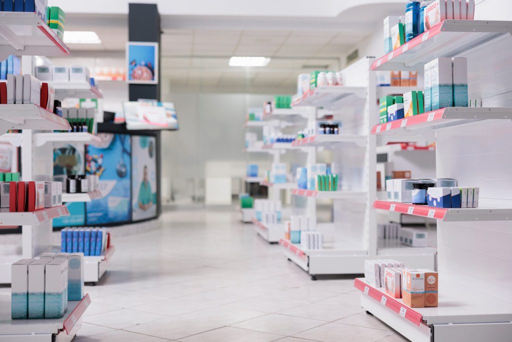 Pharmacy shelves stocked with health and medical supplies